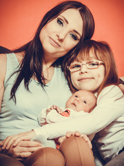 woman with daughter and newborn baby child