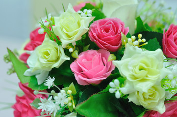 Beautiful flowers in basket on table.