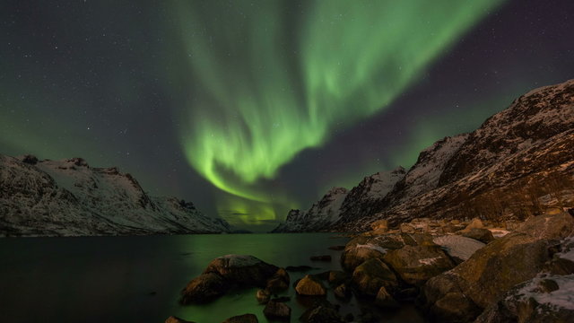 Northern Lights over fjords in Norway coast