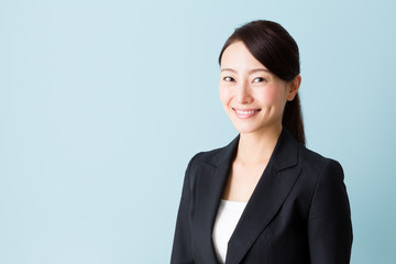 asian businesswoman on blue background