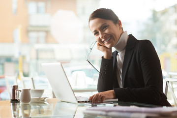 Smiling businesswoman with laptop