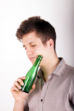 Boy with green bottle