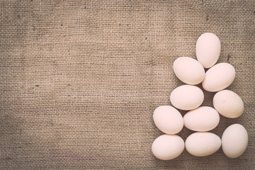 Eggs on old crumpled burlap
