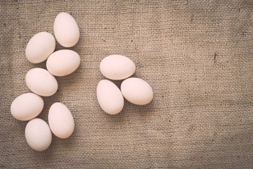 Eggs on old crumpled burlap