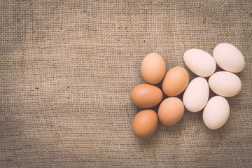 Eggs on old crumpled burlap