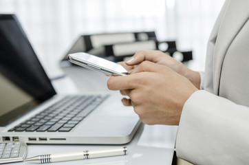 Businesswoman making global communication with smart phone