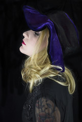 Young woman wearing floppy purple hat