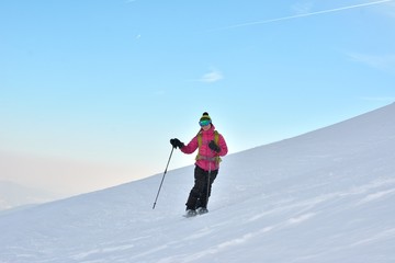 Fototapeta na wymiar Woman skier in the soft snow