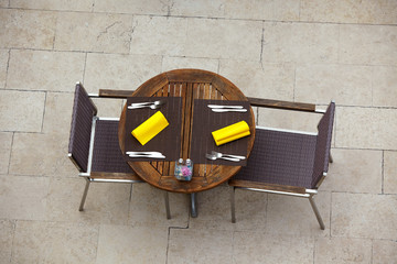 Outdoor summer cafe tables with chairs