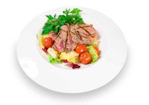 venison salad on a white plate