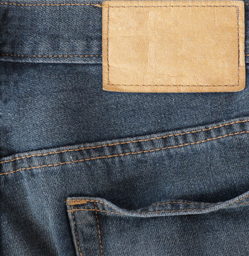 Leather jeans label sewed on jeans.