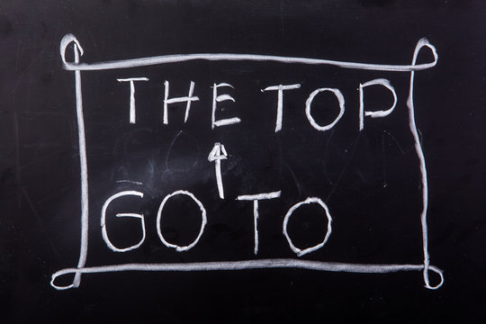 word "go to the top" on blackboard
