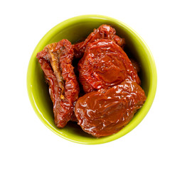 dried tomatoes in green bowl