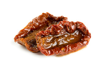 sun dried tomatoes with olive oil isolated on white