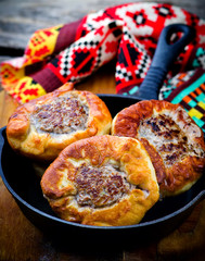 .belyash ,yeast dough round pasty with meat filling .