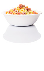 Colorful fruit flavored loops shaped cereal in a white bowl