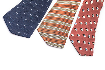 multi colored neckties on white (isolated) with copy space