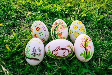 Colorful Easter eggs in a field of grass