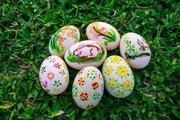 Colorful Easter eggs in a field of grass