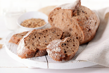 Tasty bread on table on light background