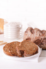Tasty bread on table on light background