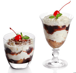 Tasty tiramisu dessert in glasses, isolated on white