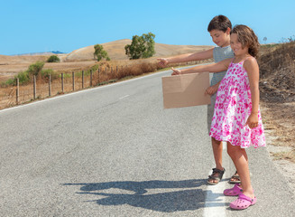 portrait of two children on the road