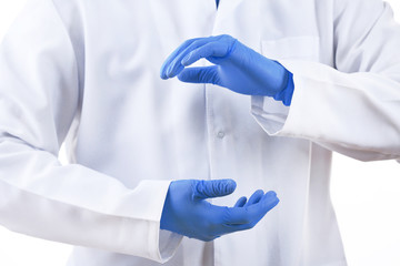 Doctor hands in medical gloves showing sign on white background