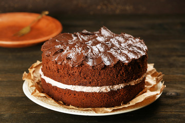 Delicious chocolate cake on table close-up