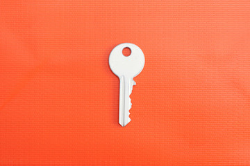 White surrealistic key with different textures: orange paper