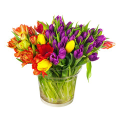 Flower bouquet from colorful tulips in glass vase isolated.