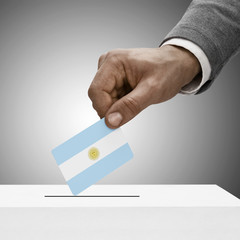 Black male holding flag. Voting concept - Argentina