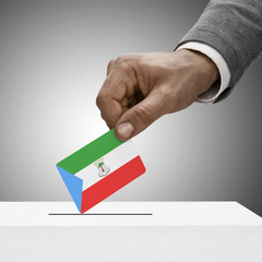 Black male holding flag. Voting concept - Equatorial Guinea