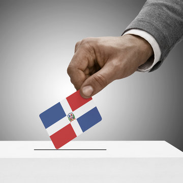 Black male holding flag. Voting concept - Dominican Republic
