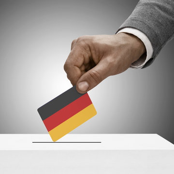 Black male holding flag. Voting concept - Germany