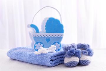 Baby accessories on table on light background