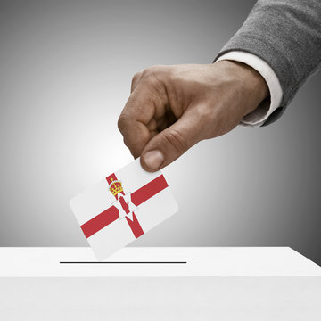 Black male holding flag. Voting concept - Northern Ireland