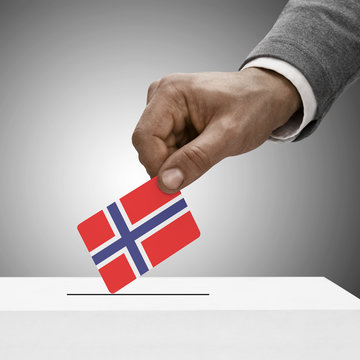 Black male holding flag. Voting concept - Norway