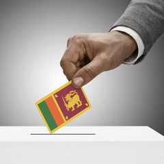 Black male holding flag. Voting concept - Sri Lanka
