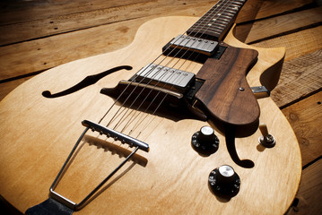 Fototapeta premium vintage jazz guitar on wood