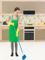 sweeping the kitchen floor