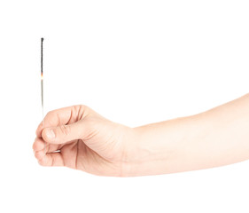 Male hand holding a sparkler isolated