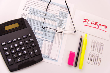 Tax preparation supplies, reading glasses and tax forms