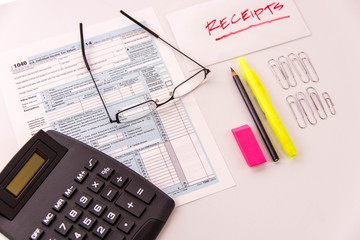 Obraz premium Tax preparation supplies, reading glasses and tax forms