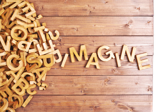 Word imagine made with wooden letters