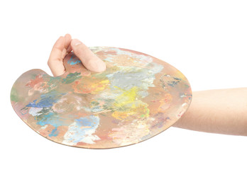 Hand holding a wooden palette isolated