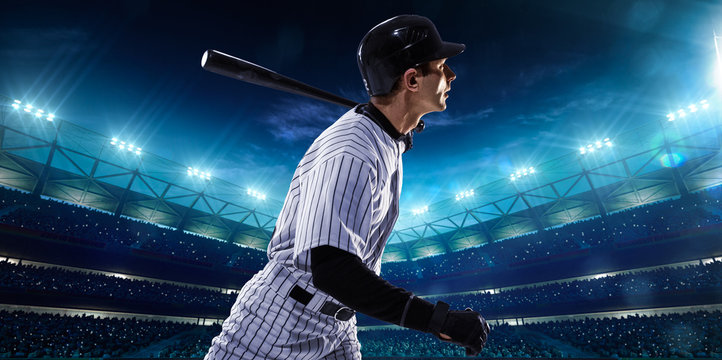 Professional baseball players on night grand arena