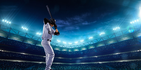 Professional baseball players on night grand arena - obrazy, fototapety, plakaty