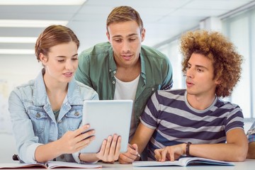 Obraz premium Fashion students using tablet