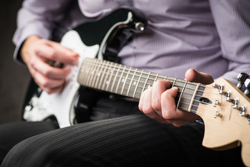Fototapeta na wymiar Man playing electric guitar